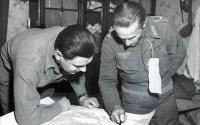Feldwebel pictured here is providing information to an Allied intelligence officer concerning positions around Haguen.jpg